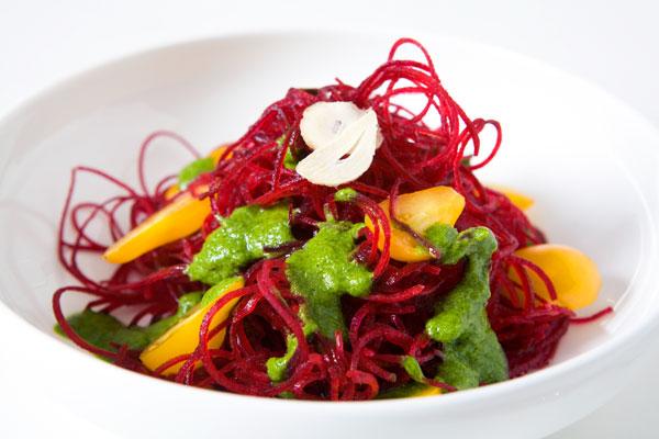 Beet capellini with arugula and pesto